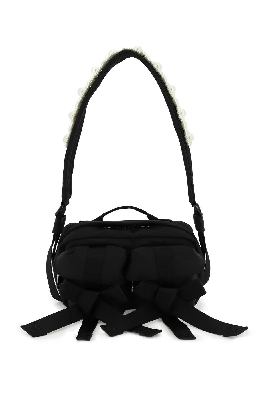 Practical women's bags with front pockets and shoulder strap for everyday use-Simone rocha nylon crossbody bag with bows and pearls