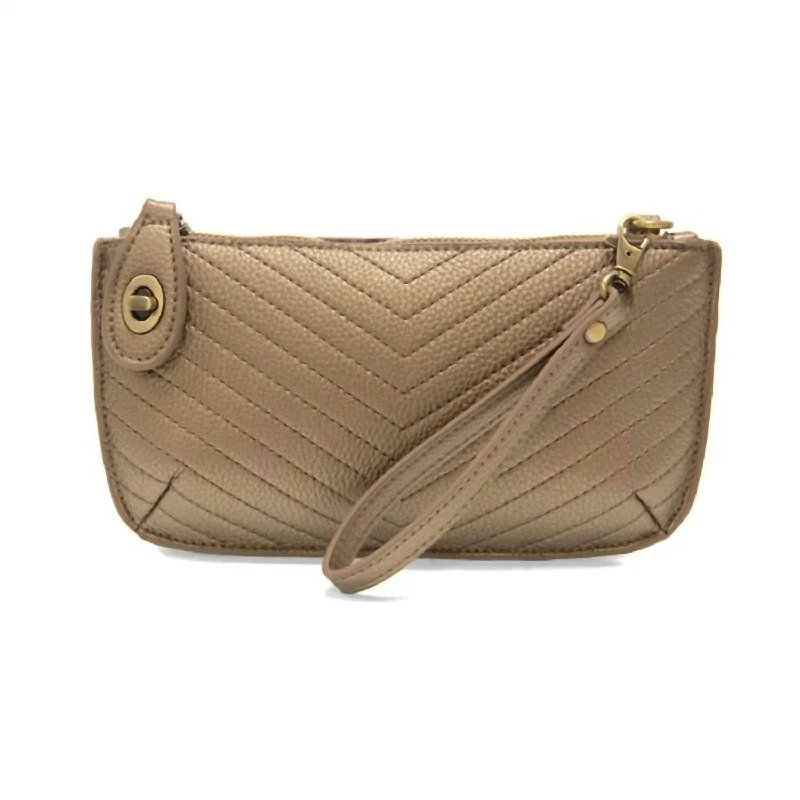 Women's bags with a fold-over top and magnetic closure for easy access and style-Mini Crossbody Wristlet In Bronze Quilted